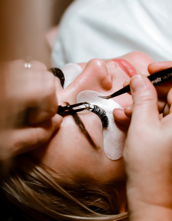 Lash artist at work in Lumiere studio