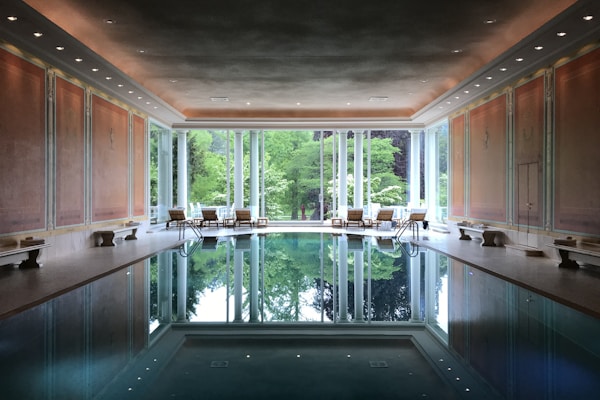 Tranquil indoor pool surrounded by nature