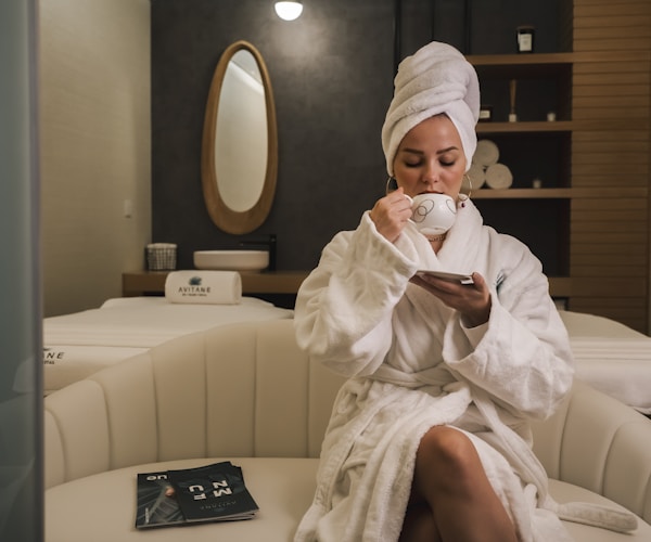 Guest relaxing in plush white robe